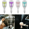 Mini car humidifier diffuser in use inside vehicle providing moisture and aromatherapy while driving