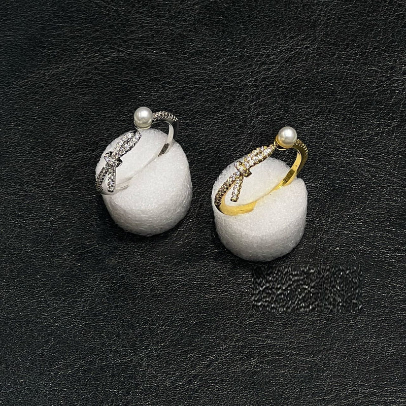 Elegant pearl twist ring with an adjustable open design for women and girls.
